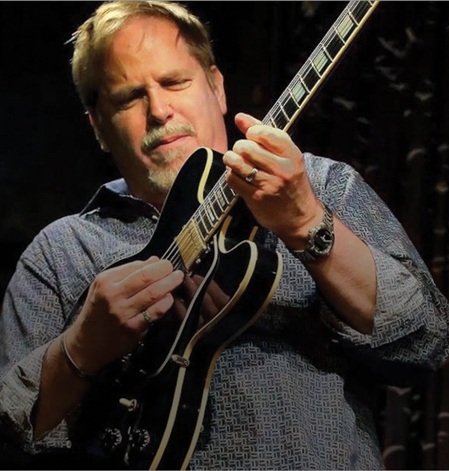 Dave Stryker playing guitar.